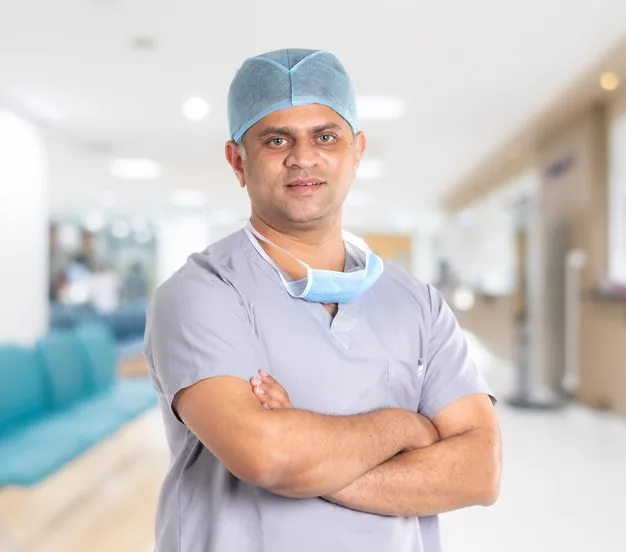 Dr. Dinesh M G in scrubs